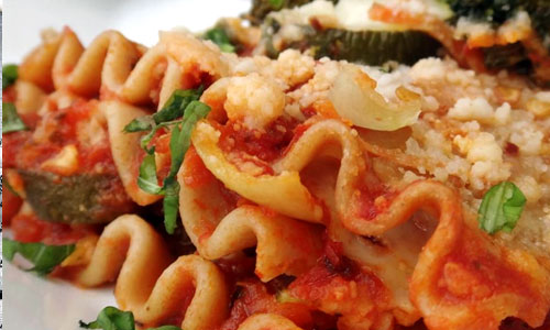 A plate of freshly baked roasted vegetable lasagna