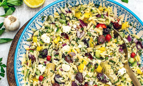 A fresh Mediterranean orzo salad with tomatoes and feta